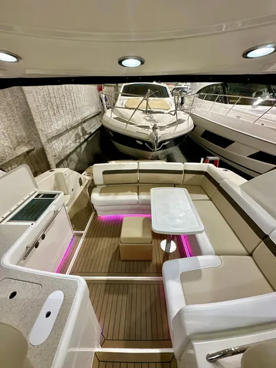 Sand Bar Yacht Photos Pics 2011 Sea Ray 450 Sundancer yacht interior with seating, table, and ambient lighting.