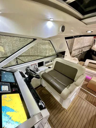 Sand Bar Yacht Photos Pics 2011 Sea Ray 450 Sundancer cockpit with modern navigation system and comfortable seating.