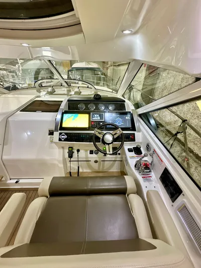 Sand Bar Yacht Photos Pics 2011 Sea Ray 450 Sundancer helm with modern navigation equipment and luxurious seating.