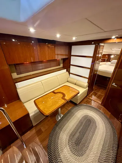 Sand Bar Yacht Photos Pics Luxurious interior of 2011 Sea Ray 450 Sundancer yacht with elegant wood finishes.