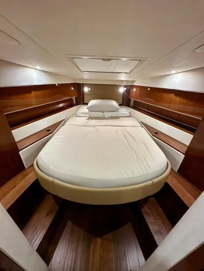 Sand Bar Yacht Photos Pics Luxurious cabin interior of 2011 Sea Ray 450 Sundancer yacht with elegant wood finish.