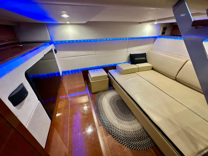 Sand Bar Yacht Photos Pics Luxurious interior of 2011 Sea Ray 450 Sundancer with modern lighting and comfortable seating.