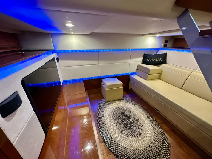 Sand Bar Yacht Photos Pics Interior of 2011 Sea Ray 450 Sundancer with modern seating, blue LED lighting, and stylish decor.