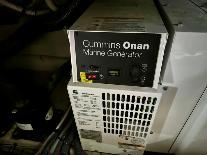Sand Bar Yacht Photos Pics Cummins Onan marine generator in 2011 Sea Ray 450 Sundancer yacht engine room.