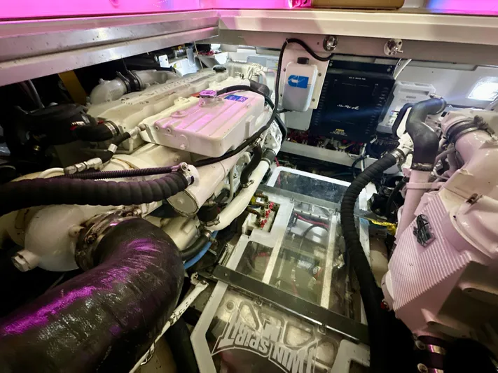 Sand Bar Yacht Photos Pics Engine room of a 2011 Sea Ray 450 Sundancer, showcasing mechanical components and systems.