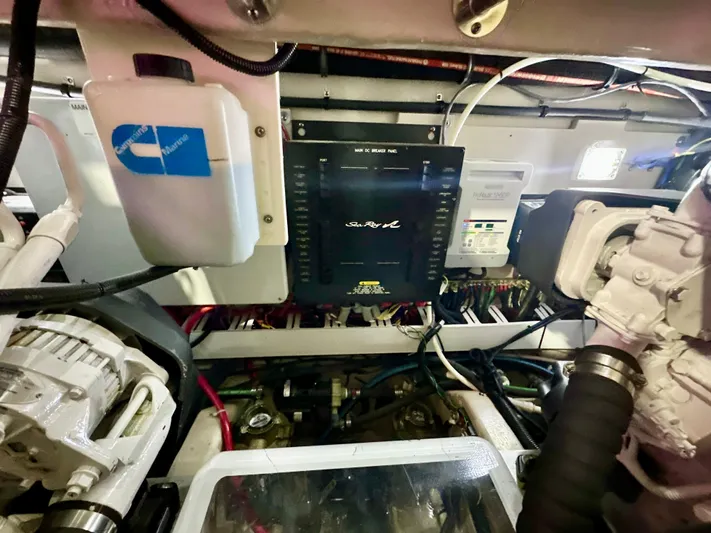 Sand Bar Yacht Photos Pics Engine room of a 2011 Sea Ray 450 Sundancer with visible control panel and components.