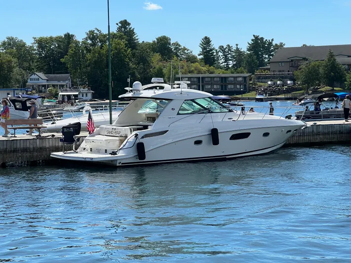 Sand Bar Yacht Photos Pics 2011 Sea Ray 450 Sundancer yacht docked at a marina on a sunny day.