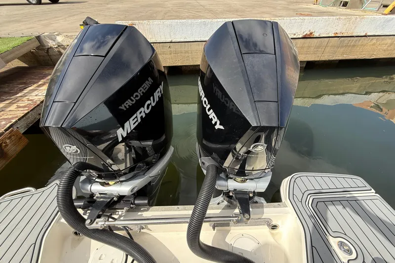  Yacht Photos Pics Twin Mercury outboard engines on a 2021 Sea Ray SDX 290 boat at the dock.