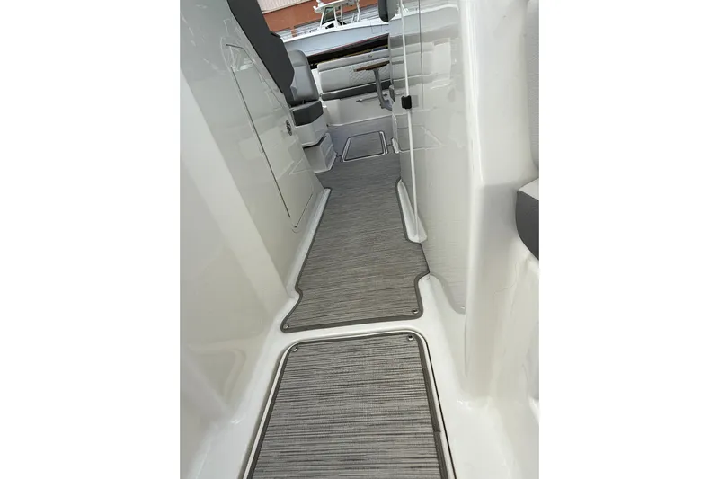  Yacht Photos Pics 2021 Sea Ray SDX 290 Outboard interior walkway with sleek design and modern flooring.