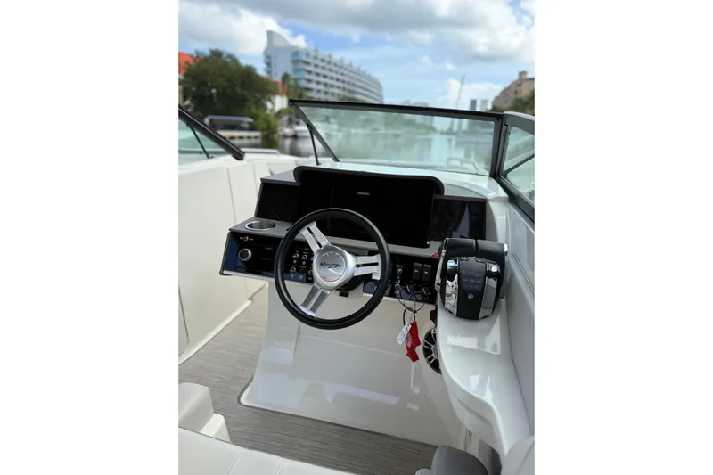  Yacht Photos Pics 2021 Sea Ray SDX 290 Outboard helm with steering wheel and controls.
