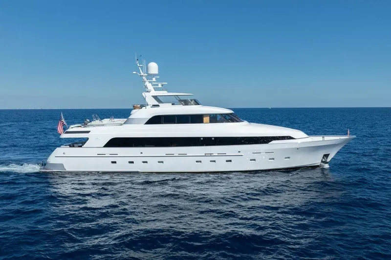 Ruffian Yacht Photos Pics Luxury Delta Marine Tri-Deck yacht cruising on open sea, 2001 model.