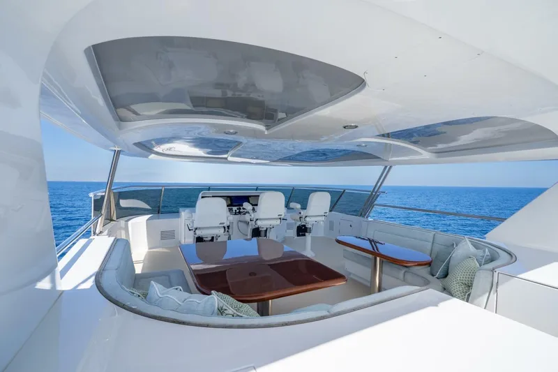 Ruffian Yacht Photos Pics Luxurious 2001 Delta Marine Tri-Deck yacht with elegant seating and ocean view.