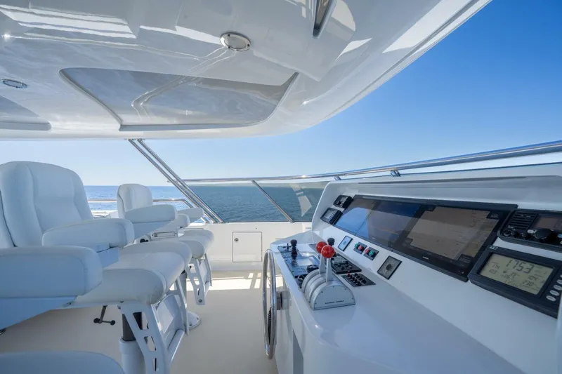 Ruffian Yacht Photos Pics Luxurious Delta Marine Tri-Deck yacht helm with modern controls and ocean view, 2001 model.