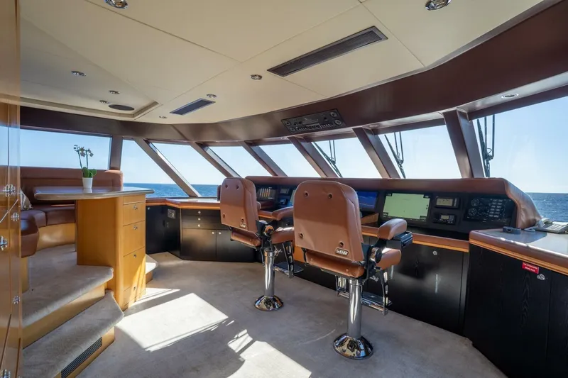 Ruffian Yacht Photos Pics Luxurious helm of 2001 Delta Marine Tri-Deck yacht with panoramic ocean views.