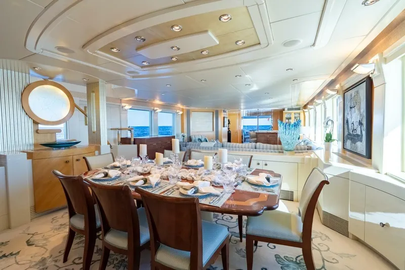 Ruffian Yacht Photos Pics Luxurious dining area on 2001 Delta Marine Tri-Deck yacht with elegant decor and ocean views.