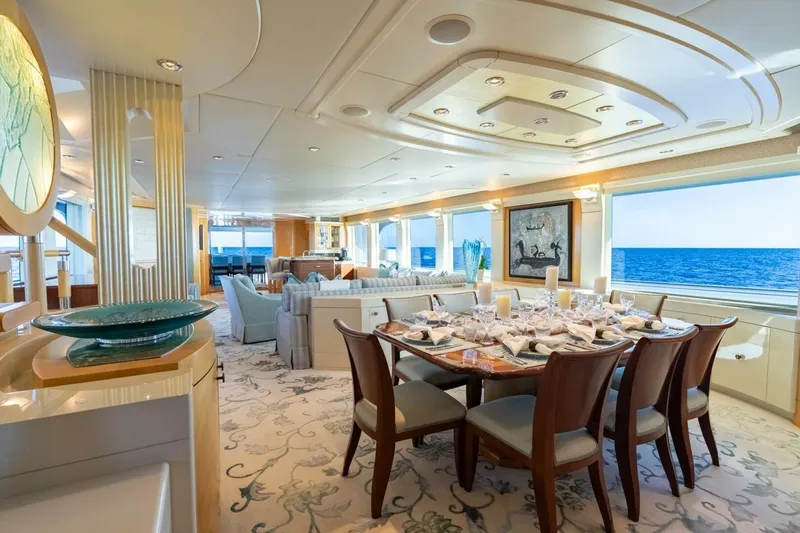 Ruffian Yacht Photos Pics Luxurious interior of 2001 Delta Marine Tri-Deck yacht with elegant dining area and ocean view.