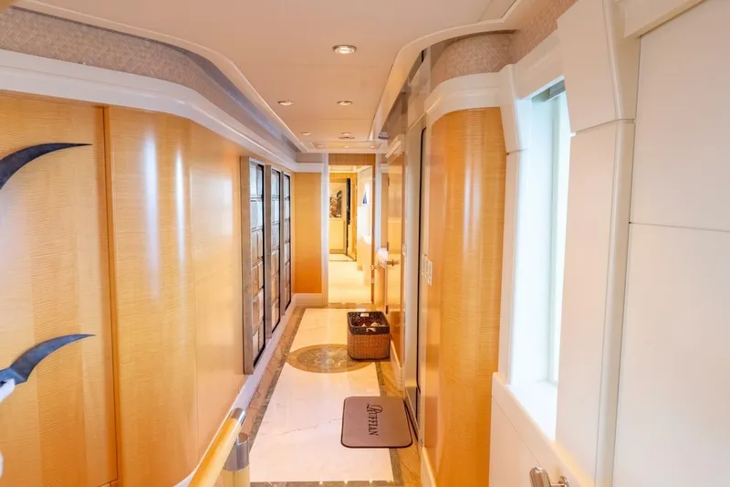 Ruffian Yacht Photos Pics Luxurious hallway interior of 2001 Delta Marine Tri-Deck yacht with elegant wood paneling.