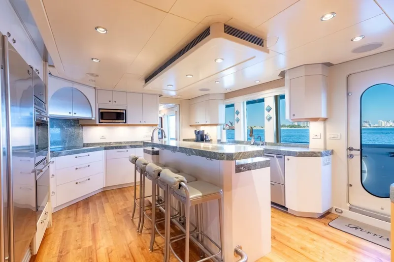 Ruffian Yacht Photos Pics Luxurious kitchen interior on 2001 Delta Marine Tri-Deck yacht with ocean view.