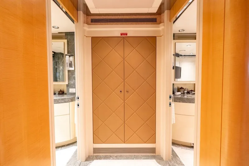 Ruffian Yacht Photos Pics Luxurious interior of 2001 Delta Marine Tri-Deck yacht with elegant wood and marble finishes.