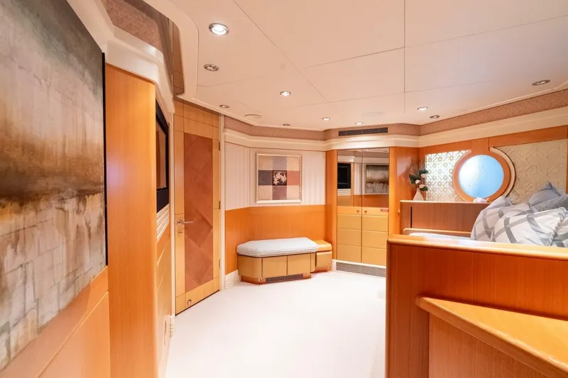 Ruffian Yacht Photos Pics Luxurious interior of 2001 Delta Marine Tri-Deck yacht with elegant wood finishes and modern decor.