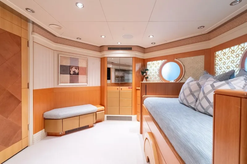 Ruffian Yacht Photos Pics Luxurious interior of 2001 Delta Marine Tri-Deck yacht with elegant wood finishes and cozy seating.