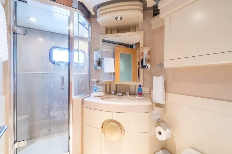 Ruffian Yacht Photos Pics Luxurious bathroom on 2001 Delta Marine Tri-Deck yacht with modern fixtures and elegant design.