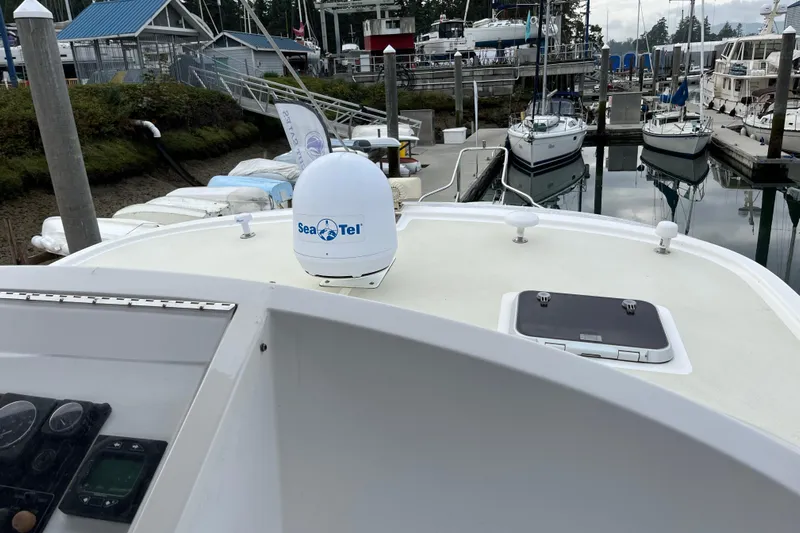 Abina Yacht Photos Pics Kadey-Krogen 39 yacht (2001) docked, featuring Sea Tel satellite dome on deck.
