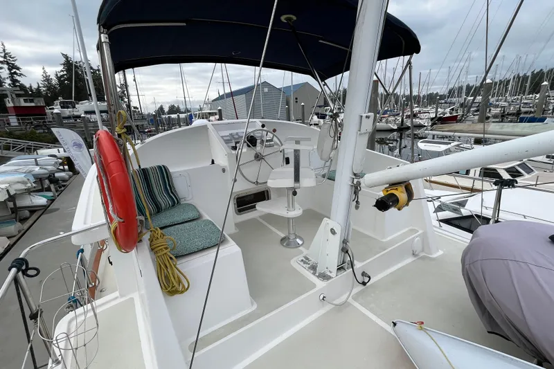 Abina Yacht Photos Pics 2001 Kadey-Krogen 39 yacht deck with helm, seating, and marina view.