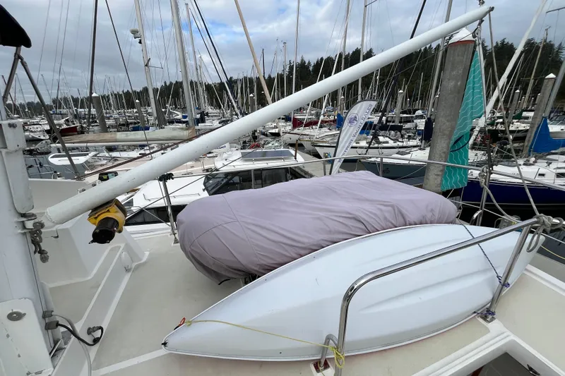 Abina Yacht Photos Pics Kadey-Krogen 39 yacht deck with covered equipment, docked in a marina, 2001 model.