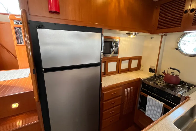Abina Yacht Photos Pics 2001 Kadey-Krogen 39 yacht kitchen with stove, fridge, and microwave.