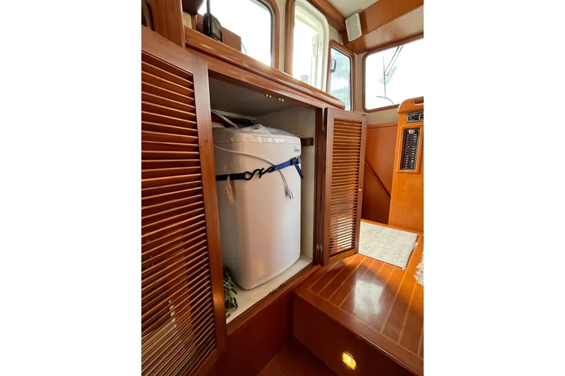 Abina Yacht Photos Pics 2001 Kadey-Krogen 39 interior with wooden cabinetry and secured white appliance.