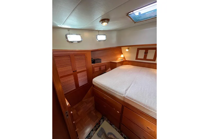 Abina Yacht Photos Pics Cozy cabin interior of 2001 Kadey-Krogen 39 yacht with wooden furnishings.