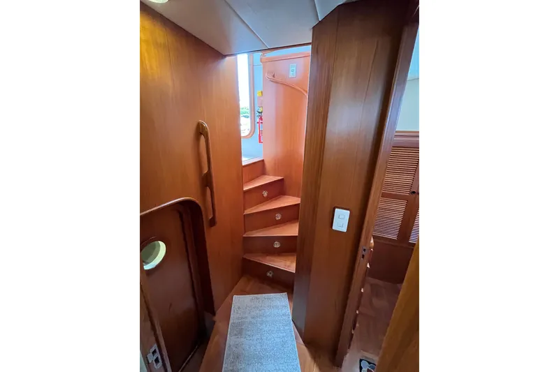 Abina Yacht Photos Pics Interior of 2001 Kadey-Krogen 39 yacht, featuring wooden stairs and elegant design.