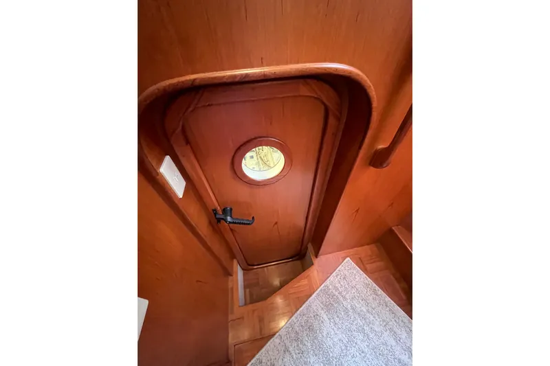 Abina Yacht Photos Pics Wooden interior door with porthole on 2001 Kadey-Krogen 39 yacht.