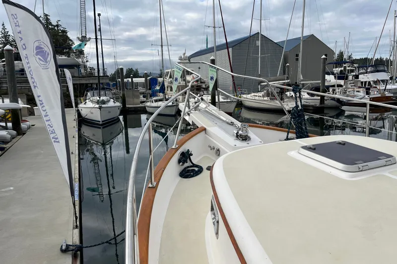 Abina Yacht Photos Pics Kadey-Krogen 39 yacht docked at marina, 2001 model, surrounded by other boats.