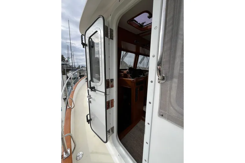 Abina Yacht Photos Pics 2001 Kadey-Krogen 39 yacht, open door view, showcasing interior and deck details.