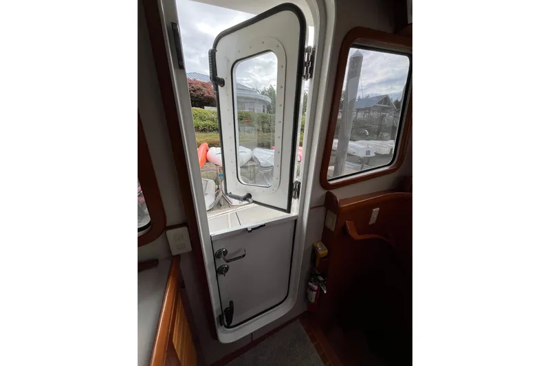 Abina Yacht Photos Pics Interior view of 2001 Kadey-Krogen 39 boat with open door and window.