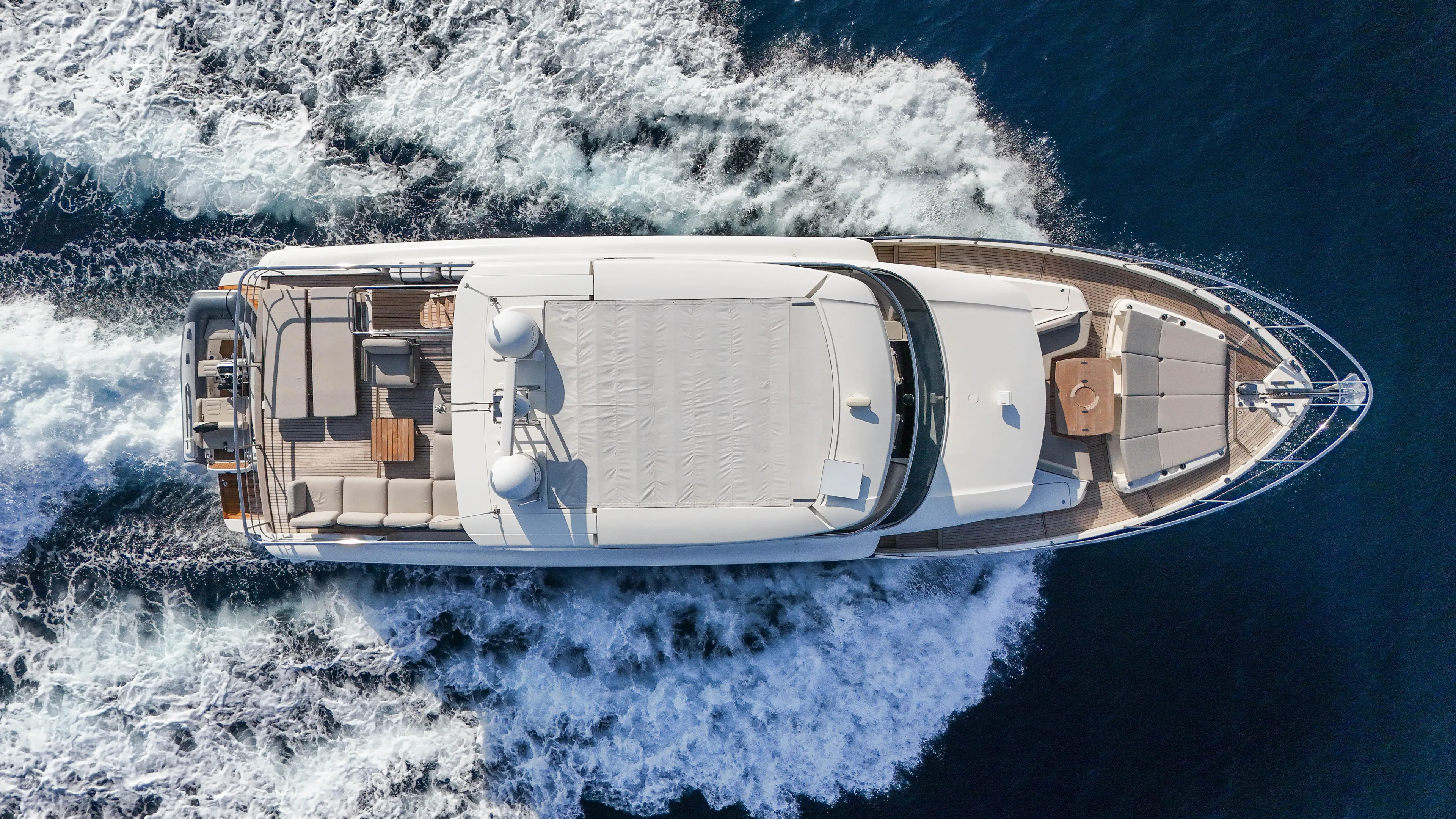 Yacht Photos Pics Overhead view of 2023 Absolute Navetta 68 yacht cruising on the ocean.