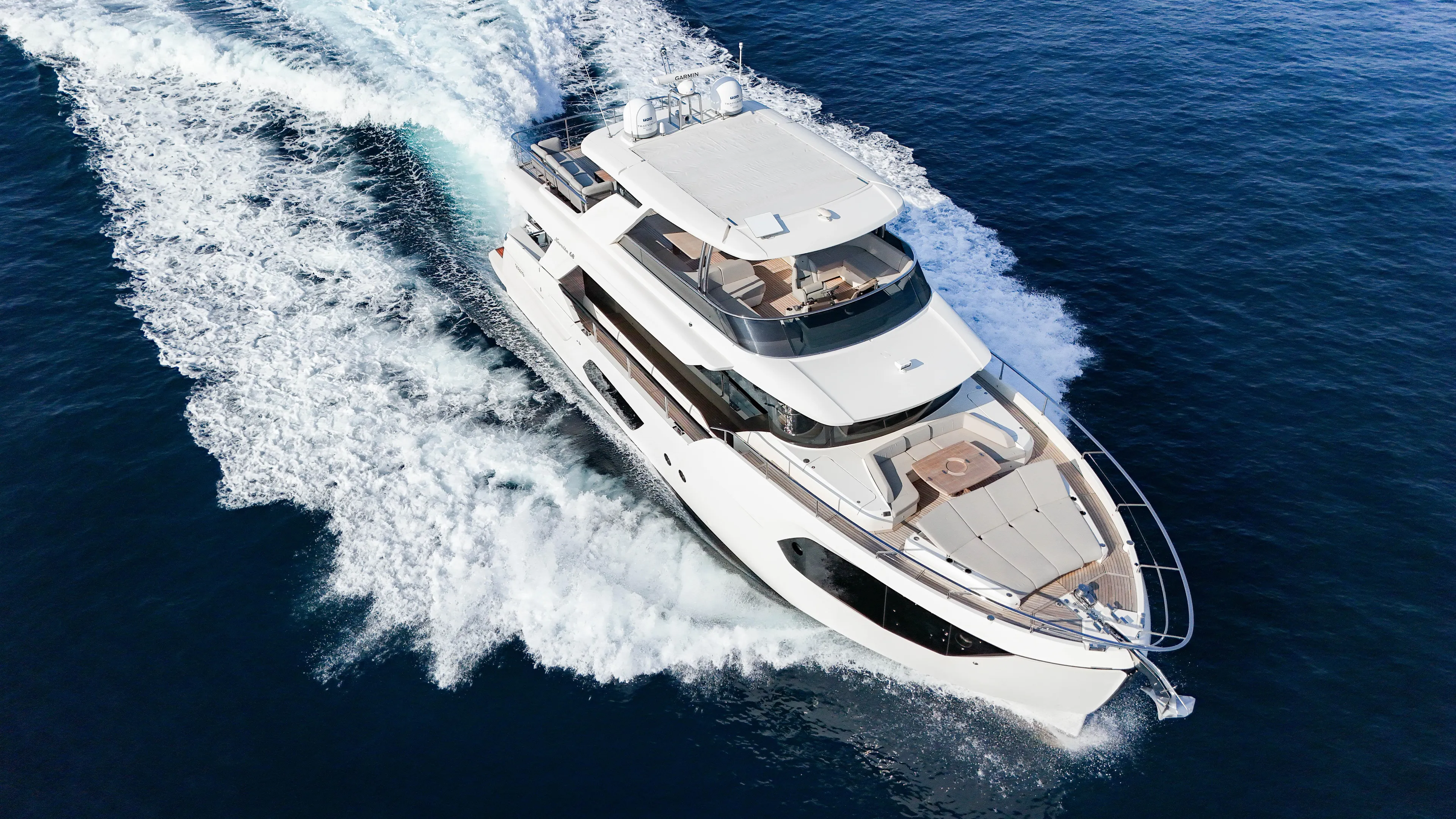  Yacht Photos Pics 2023 Absolute Navetta 68 yacht cruising on open water, aerial view.