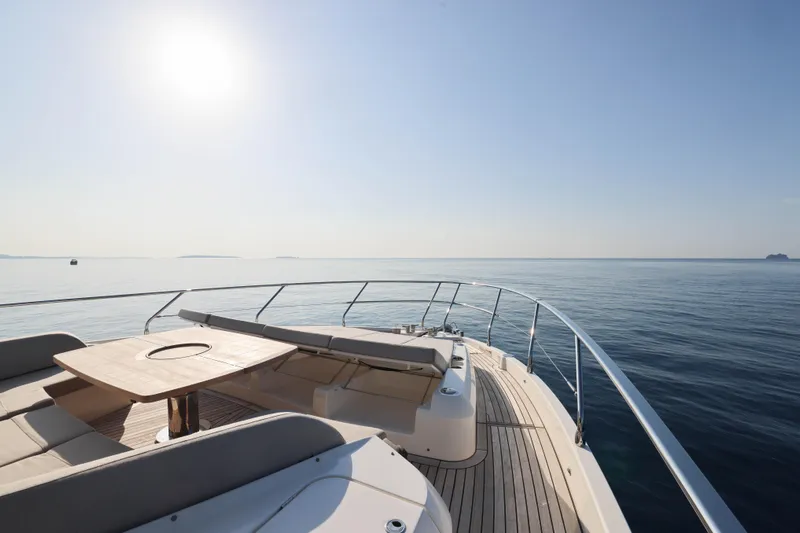 Yacht Photos Pics Luxurious 2023 Absolute Navetta 68 yacht deck with ocean view and seating area.