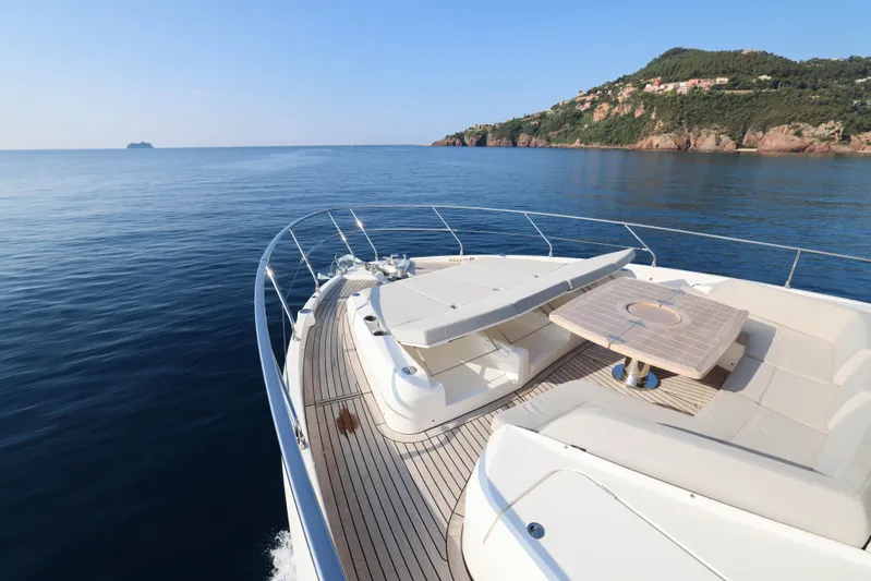  Yacht Photos Pics Luxurious 2023 Absolute Navetta 68 yacht deck with scenic ocean and coastal views.