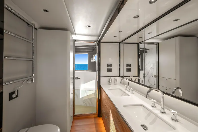  Yacht Photos Pics Luxurious bathroom on 2023 Absolute Navetta 68 yacht with ocean view and modern fixtures.
