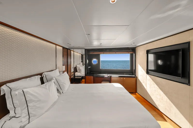  Yacht Photos Pics Luxurious bedroom on 2023 Absolute Navetta 68 yacht with ocean view and modern decor.