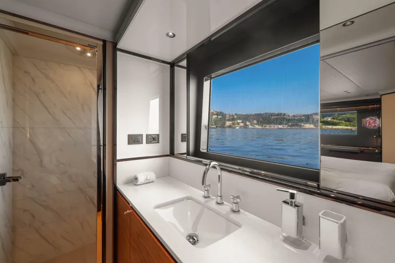  Yacht Photos Pics Luxurious bathroom on 2023 Absolute Navetta 68 yacht with scenic ocean view.