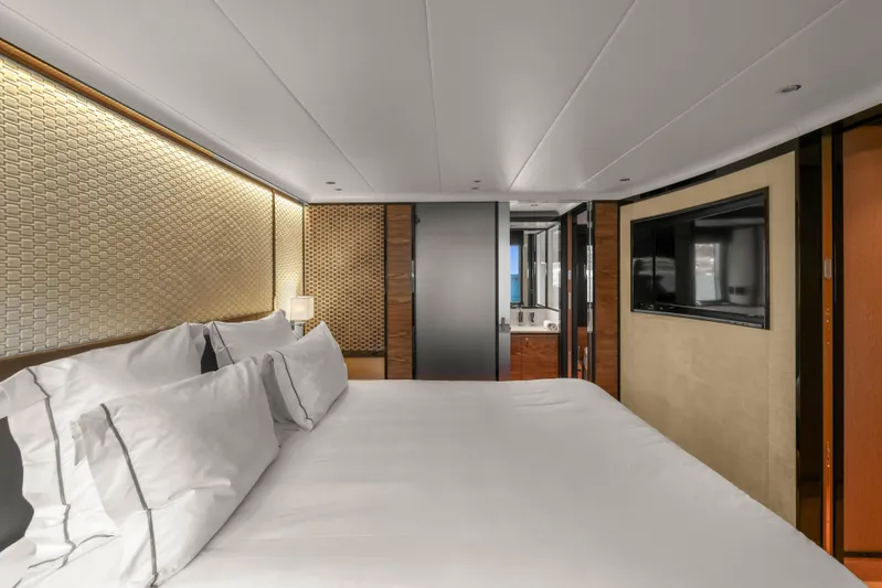  Yacht Photos Pics Luxurious bedroom interior of 2023 Absolute Navetta 68 yacht with modern design and elegant decor.