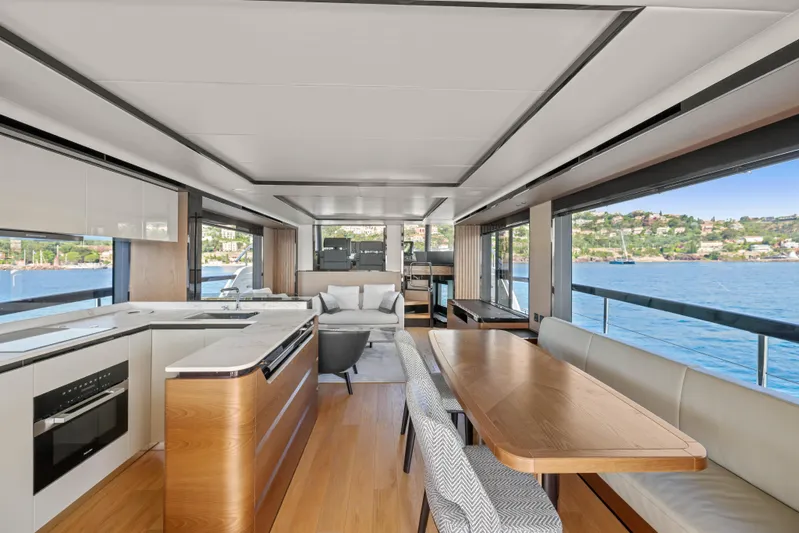  Yacht Photos Pics Luxurious interior of 2023 Absolute Navetta 68 yacht with modern kitchen and dining area.