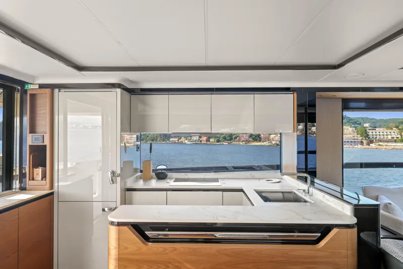  Yacht Photos Pics Luxurious kitchen interior of 2023 Absolute Navetta 68 yacht with scenic ocean view.