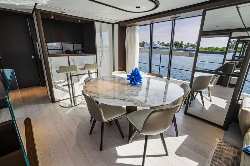  Yacht Photos Pics Luxurious 2023 Ferretti Yachts 860 interior with elegant dining area and scenic ocean view.