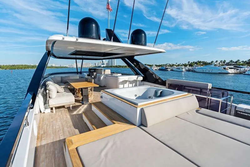  Yacht Photos Pics Luxurious 2023 Ferretti Yachts 860 with spacious deck and jacuzzi, docked in scenic marina.
