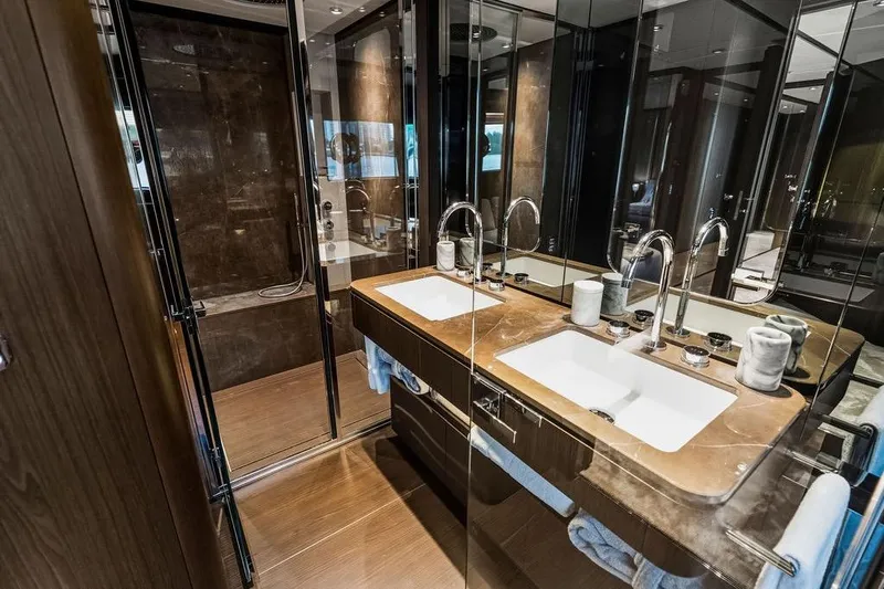  Yacht Photos Pics Luxurious bathroom in 2023 Ferretti Yachts 860, featuring dual sinks and elegant design.